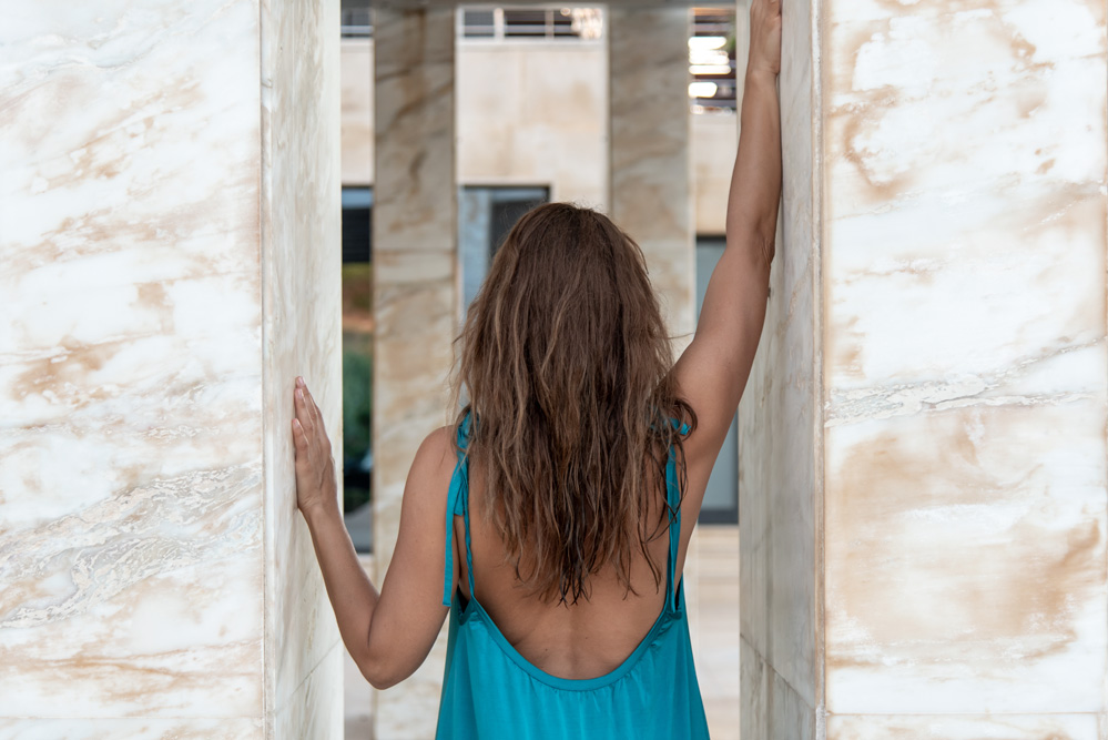 Woman posing in the outdoor area at Cretan Dream Resort & Spa